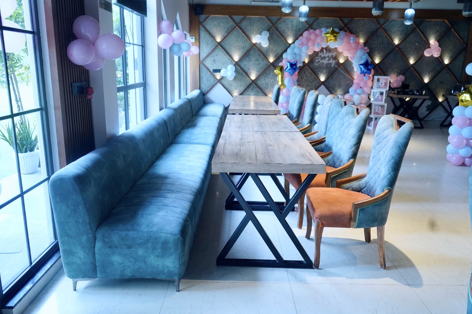 A bright restaurant venue decorated for a first birthday celebration